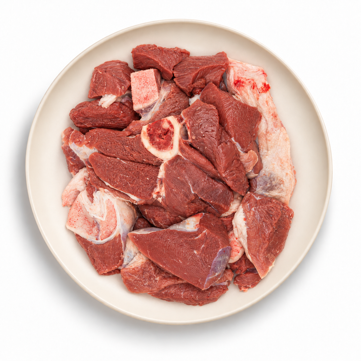 Mixed meat cuts on an ivory plate against a white background