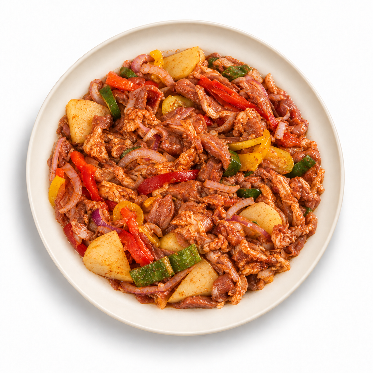 Lamb with vegetables on an ivory plate against a white background